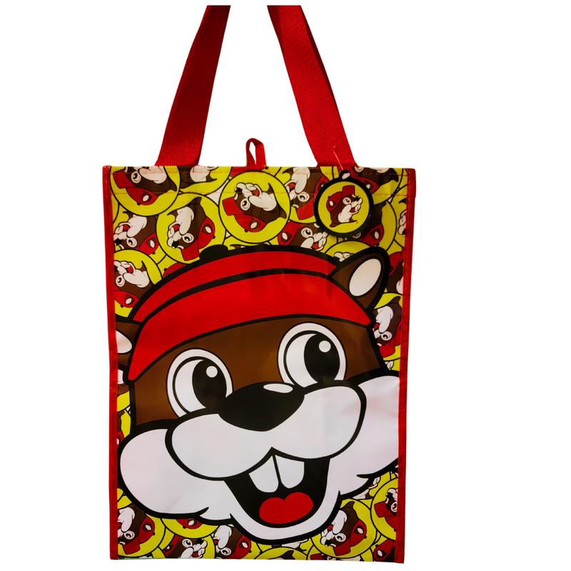 Durable eco-friendly turquoise Buc-ee’s two-sided grocery bag featuring vibrant design and iconic mascot, perfect for groceries, snacks, and on-the-go use